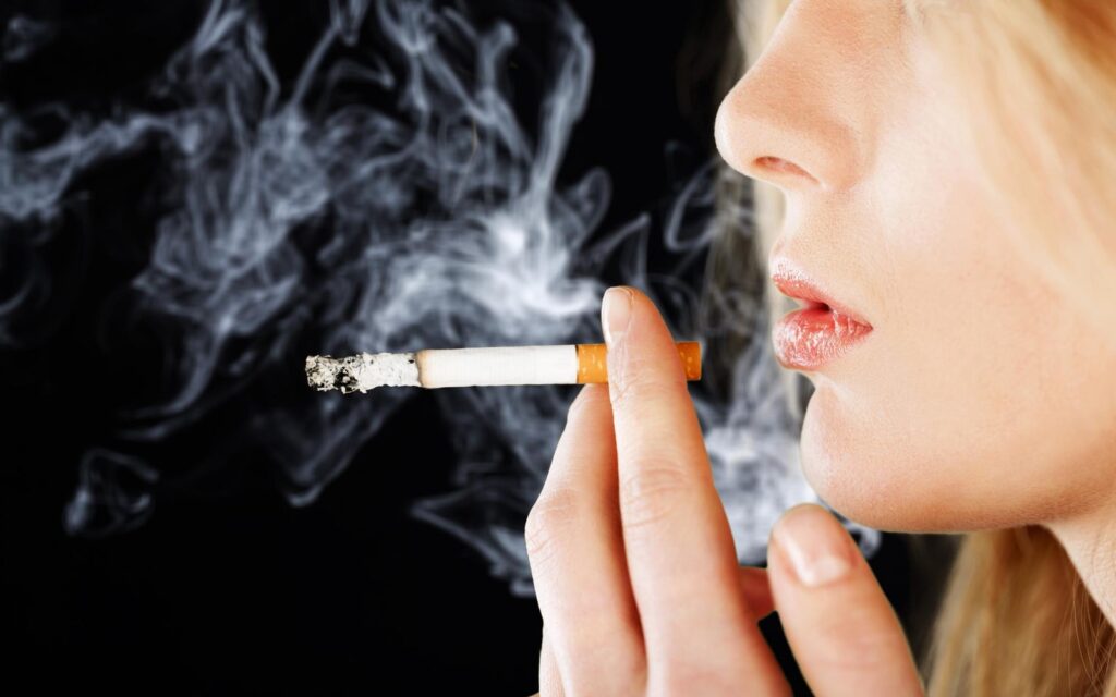 Portrait of a woman smoking a cigarette